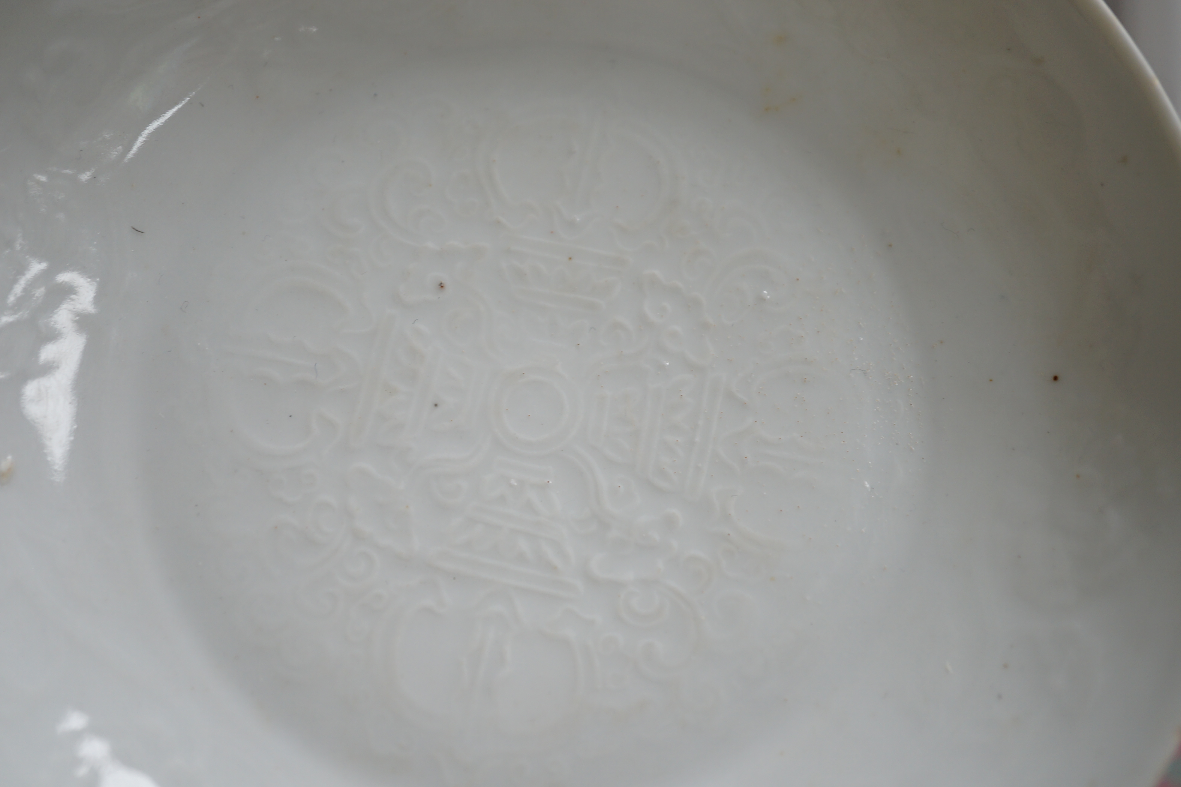 A Chinese moulded white glazed saucer dish, Yongle mark, Republic period